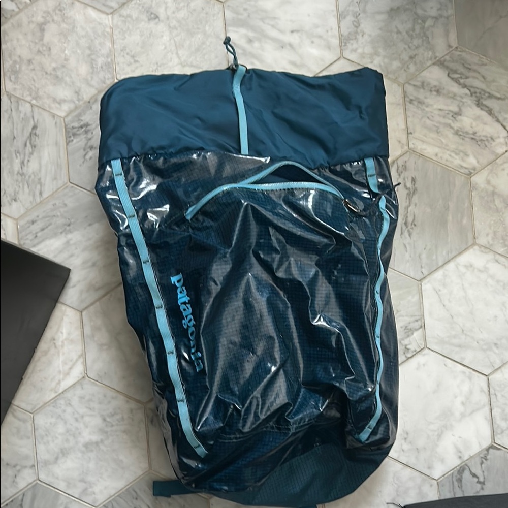 Patagonia Dark Teal Roll-Top Backpack with Light Teal Trim